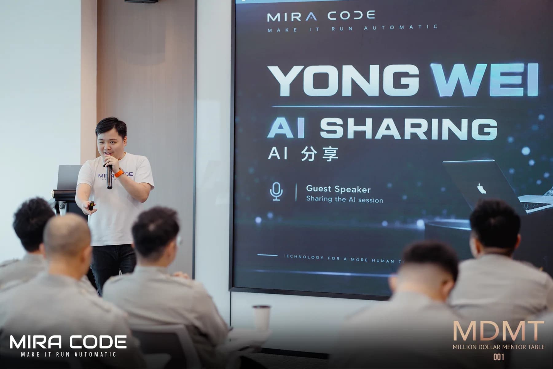 A MIRA CODE speaker presenting an AI sharing session to an audience.